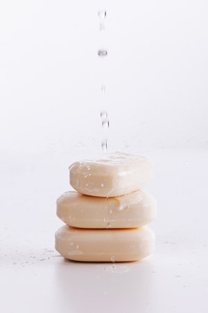 drops of water falling on the soapの写真素材