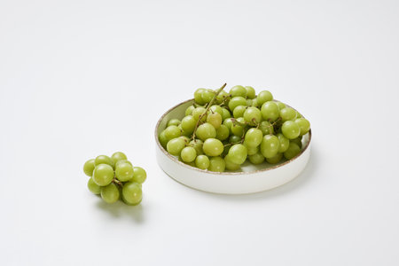 Fresh Shine Cuscat grapes on a plateの写真素材