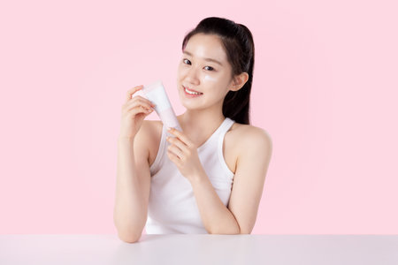 Teenage woman posing with cosmeticsの写真素材