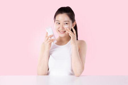 Teenage woman posing with cosmeticsの写真素材