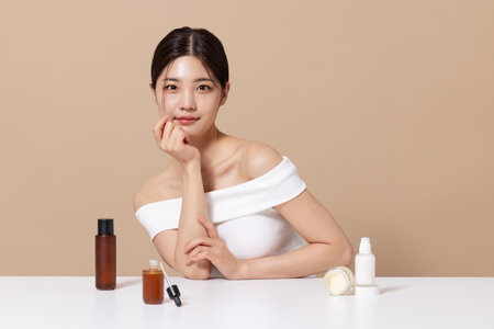 Woman in her 20s holding cosmeticsの写真素材