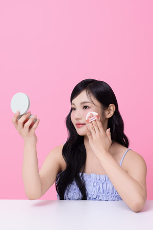 Cropped view of young woman posing with cushionの写真素材
