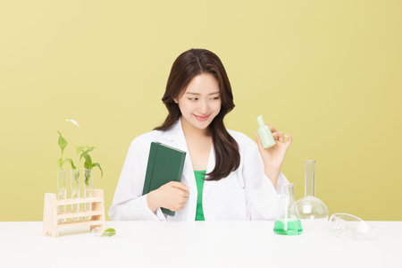 A woman wearing a doctor's gown is holding eco-friendly cosmetics