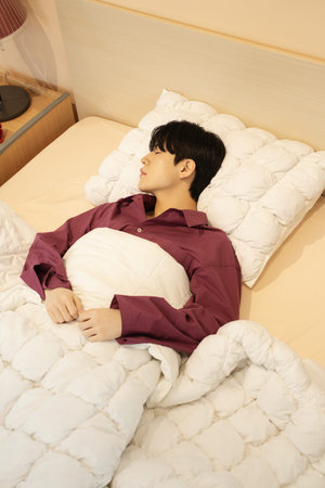 A man sleeping in bed