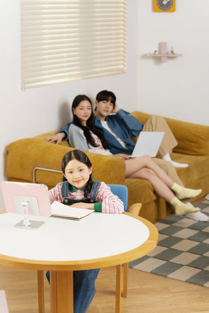 Parents watching their child learn from behind