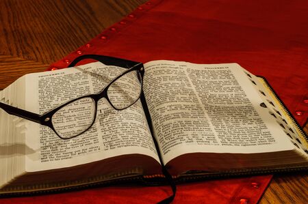 Glasses on open Study Bibleの写真素材