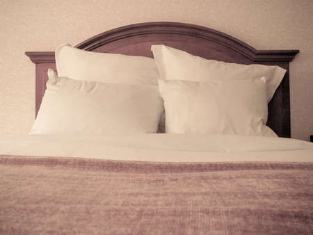 Detail of Pristine Bed with Wooden Headboardの写真素材