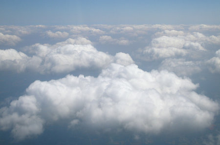 In the Sky with White Fluffy Clouds Viewed From Above