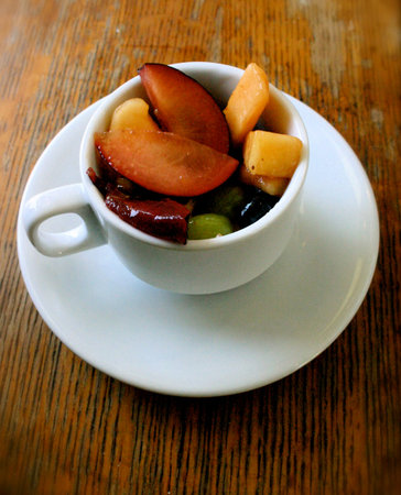 Elegant Fruit Salad Served in a Tea Cupの写真素材