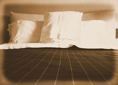 Simply Made Up Bed in Bedroomの写真素材