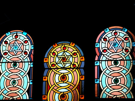Stained Glass Windows with Star of David Designs in Jewish Synagogue Interior