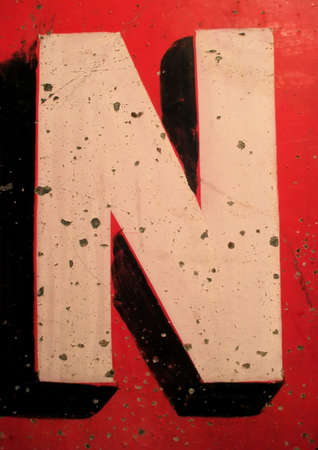Letter N on Antique Tin Sign with Peeling Paintの写真素材