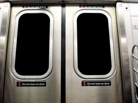 New York City Subway Train with Do Not Lean on Door Warning Signの写真素材
