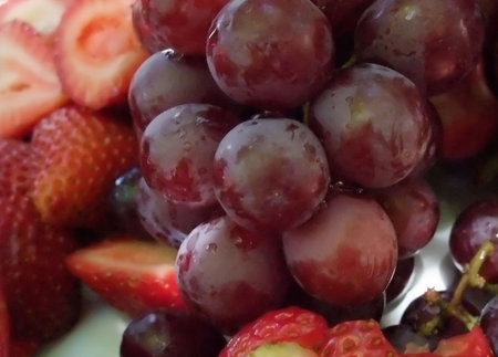 Detail of Fresh Fruit Platter with Grapes and Strawberriesの写真素材