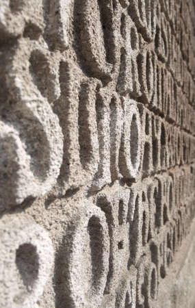 Words Written in Stone: Abstracted Religious Text on Church Wallの写真素材