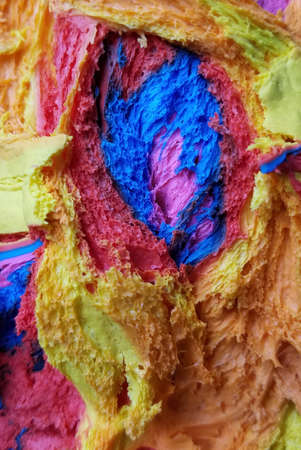 Creativity in the kitchen: layers of colorful rainbow bread doughの写真素材