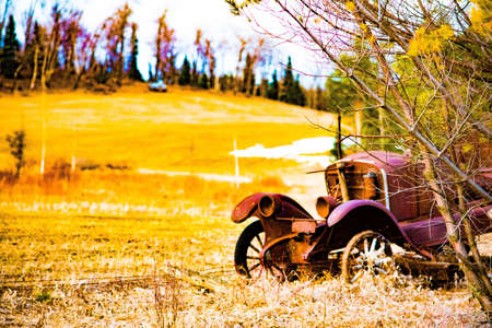 Classic car by barb wire fenceの素材