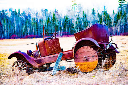 Classic car by barb wire fenceの素材