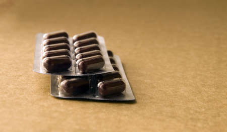 Brown vitamin pills in the pill boxの写真素材