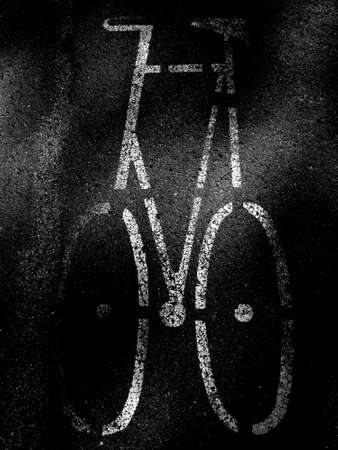 Bicycle icon painted on sidewalkの写真素材