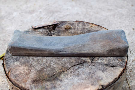 Old whetstone put on old woodenの写真素材