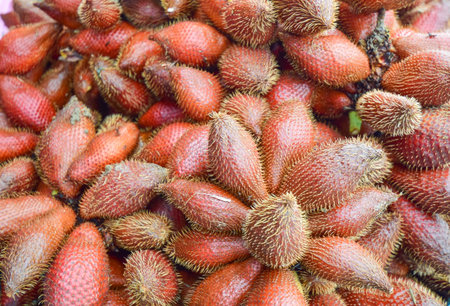 Group of salacca fruit put on the table for sale in store at Rayong province Thailand.