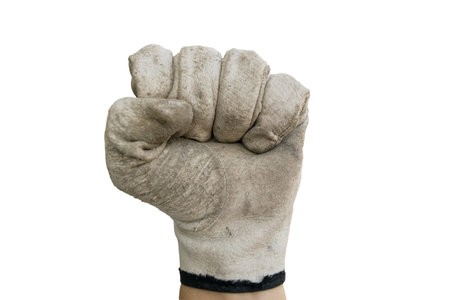 Fist with old glove on the white background.の写真素材
