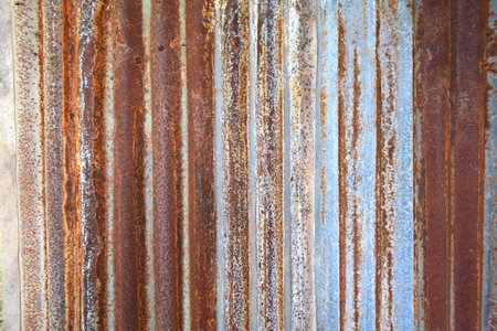 Rusty galvanized iron wall texture with the red orange and brown colors.の写真素材