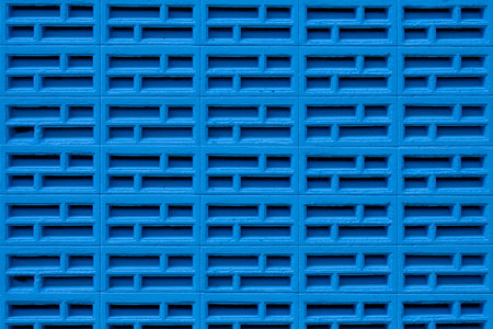 The texture of the brick wall of many rows of bricks painted in blue color. Background and wall paper.の写真素材