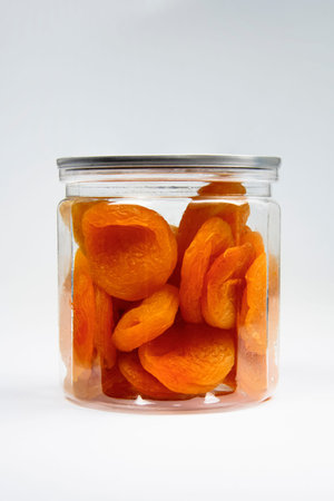 Apricot in a jar  white background   .