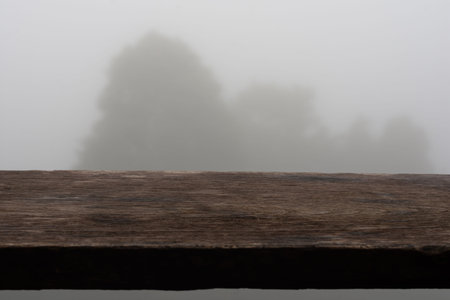 Wooden planks on blurry fog background.