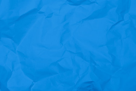 Blue crumpled paper texture background. Blue wrinkled paper texture background. Blue crease fabric texture background. Blue wrinkled fabric texture background.の写真素材