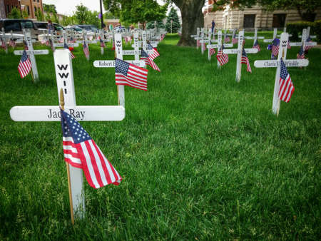 Memorial crosses to honor Memorial Day in town courtyard.の素材