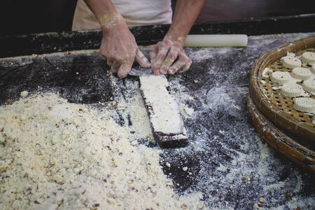 Macau Worker making almond cookie from a moldの写真素材