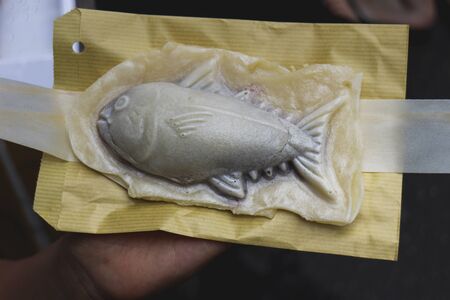 Taiyaki fished shaped desert filled with red bean in Japanの写真素材