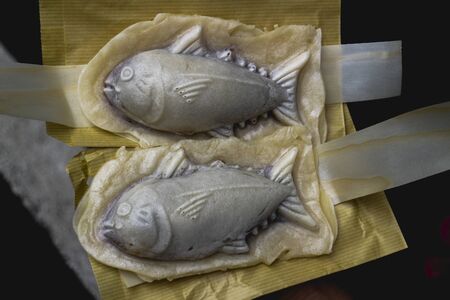 Taiyaki fished shaped desert filled with red bean in Japanの写真素材