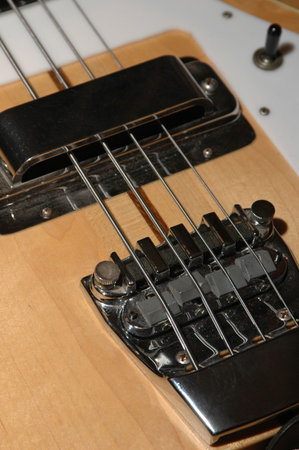 Electric bass, natural wood finish