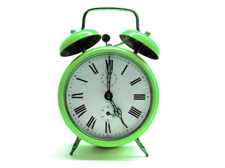 An older alarmclock showing the time of 5 o´clock