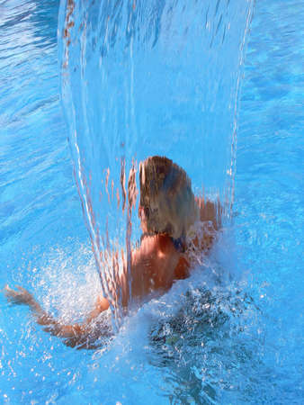 a woman in a spa waterfallの写真素材