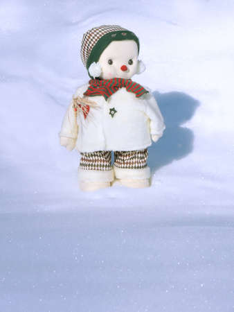A snowman standing in the fresh cold sparkling snowの写真素材