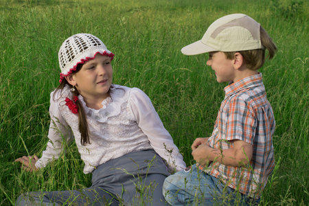 Children rest in nature on the lake in summerの写真素材