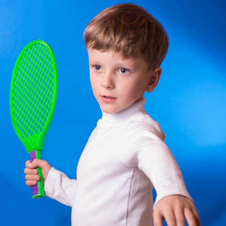 the boy the sportsman with a tennis racket in handsの写真素材