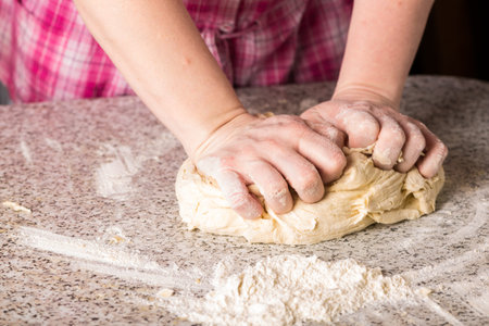 Housewife making dough at home.の写真素材