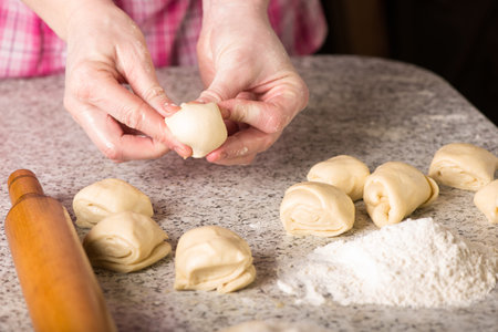 Housewife making dough at home.の写真素材