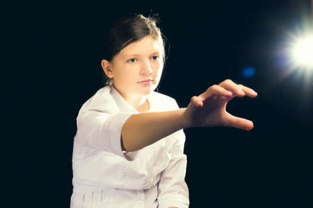 Pushed my hand into the virtual space to a bright ballの写真素材