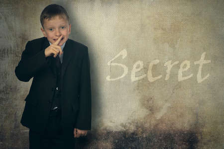 Guy observes silence. He put his hands over his mouth and said nothing.の写真素材