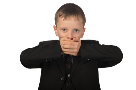 Guy observes silence. He put his hands over his mouth and said nothing.の写真素材