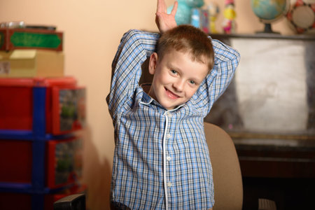 Young man in an office chair. Different facial expressions and emotional moods.の写真素材