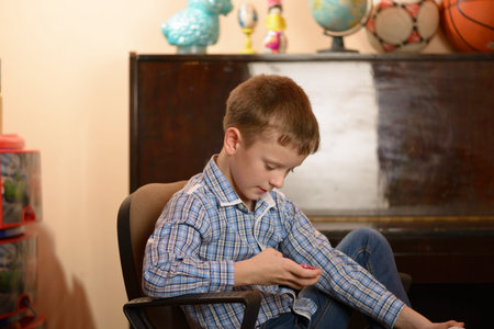 A young man with a cell phone in his hand. Different facial expressions and emotional moods.
