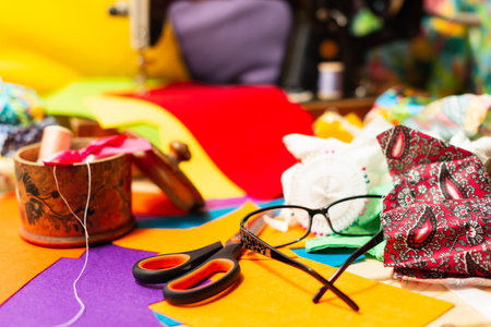 Sewing on a sewing machine design. Making objects with your own hands. Multicolored threads and...